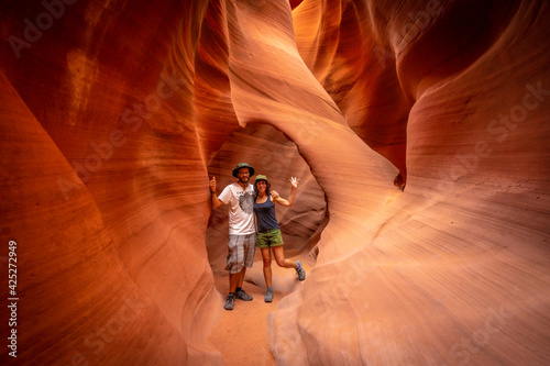 A couple in a small tunnel in Lower Antelope. Arizona, United States