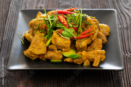 Stir Fried Pork Ribs Red Curry Paste And Coconut Milk.