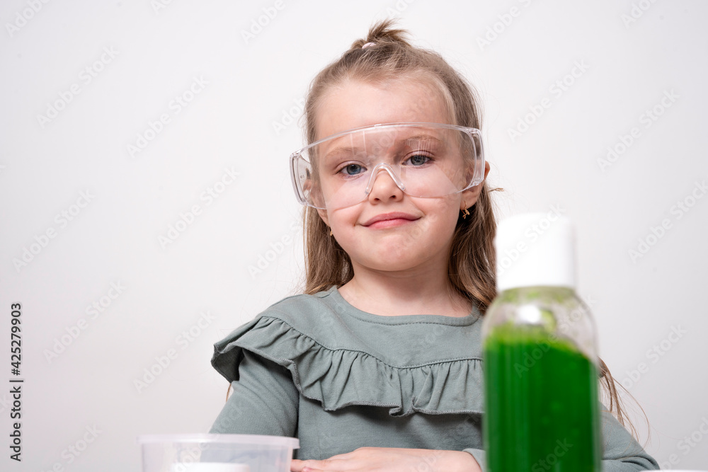 Laboratory, kids chemical experiments day 2 of 14. A preschool girl, wearing goggles, bottom view Laboratory, kids chemical experiments day 2 of 14. A preschool girl, wearing goggles, bottom view