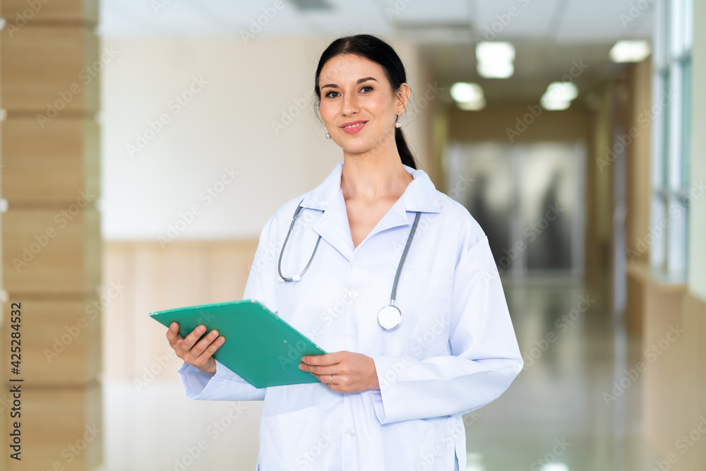 Portrait attractive confident and young female doctor  in white coat with stethoscope. Healthcare And Medical concept.