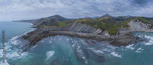 Zumaia and Deba flysch geological strata layers drone aerial view, Basque Country