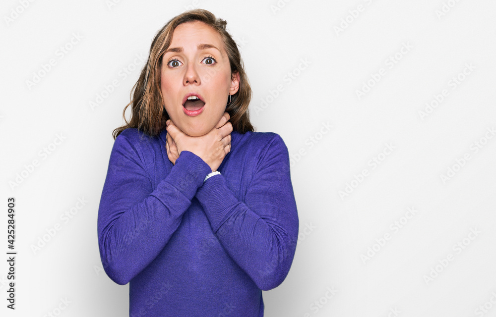 Young blonde woman wearing casual clothes shouting and suffocate because painful strangle. health problem. asphyxiate and suicide concept. Young blonde woman wearing casual clothes shouting and suffocate because painful strangle. health problem. asphyxiate and suicide concept.