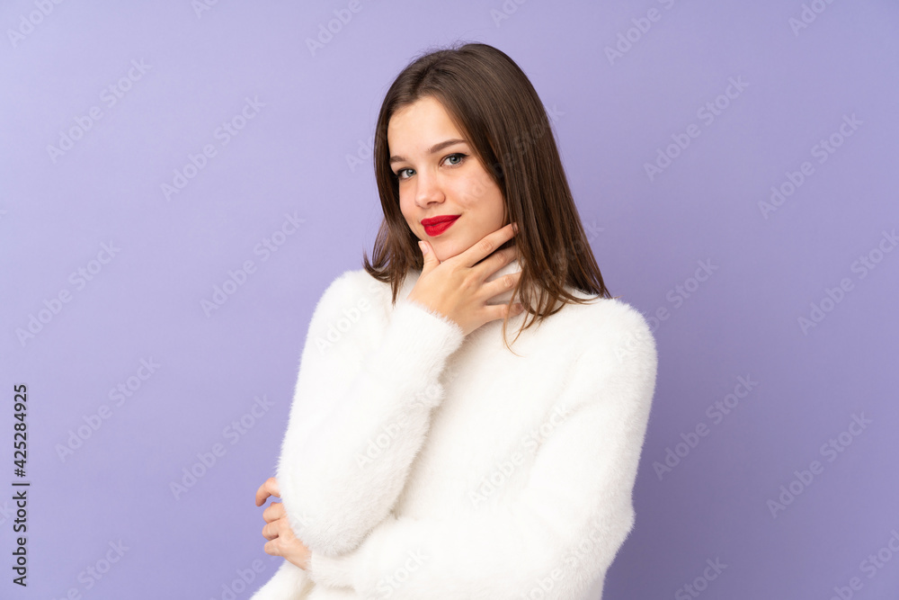 Teenager girl isolated on purple background smiling Teenager girl isolated on purple background smiling