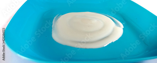 White cream on a blue plate