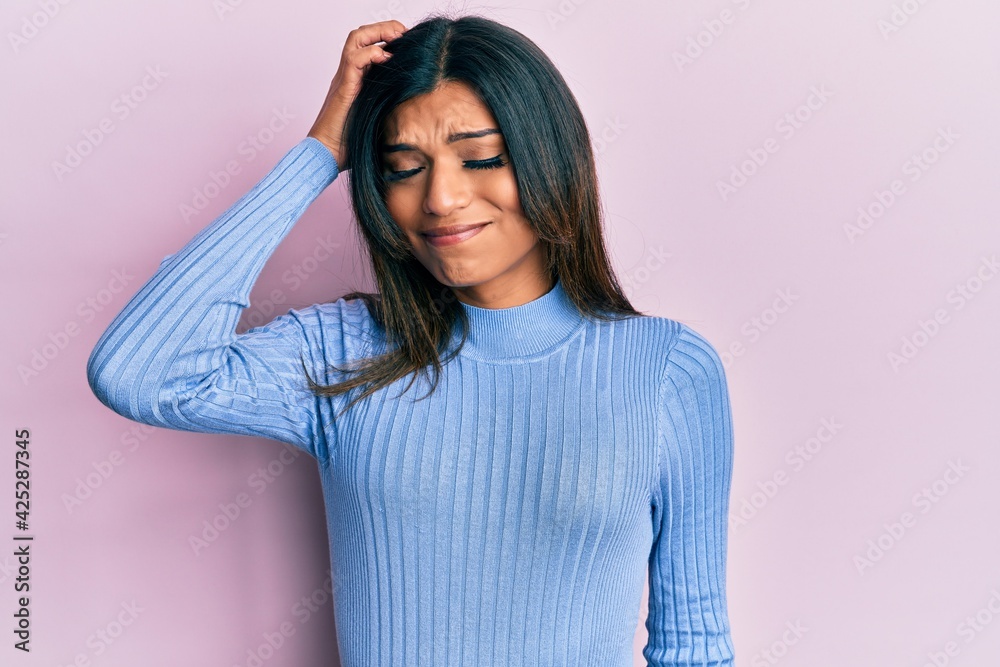 Young latin transsexual transgender woman wearing casual clothes confuse and wonder about question. uncertain with doubt, thinking with hand on head. pensive concept. Young latin transsexual transgender woman wearing casual clothes confuse and wonder about question. uncertain with doubt, thinking with hand on head. pensive concept.