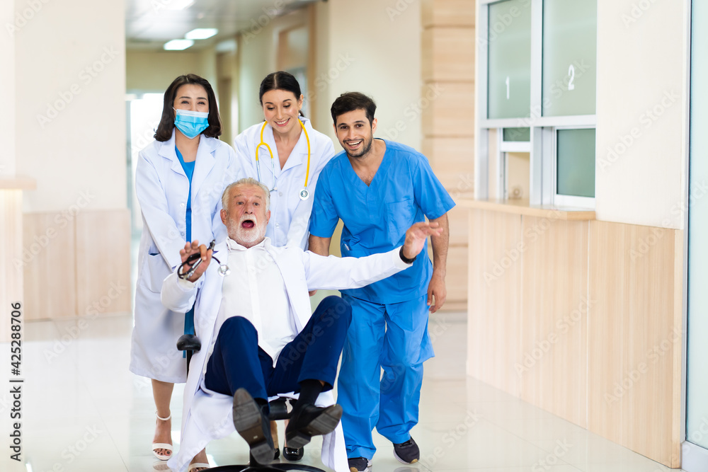 Cheerful doctor colleagues having fun in hospital. Cheerful doctor and nurse relax after work. Cheerful doctor colleagues having fun in hospital. Cheerful doctor and nurse relax after work.