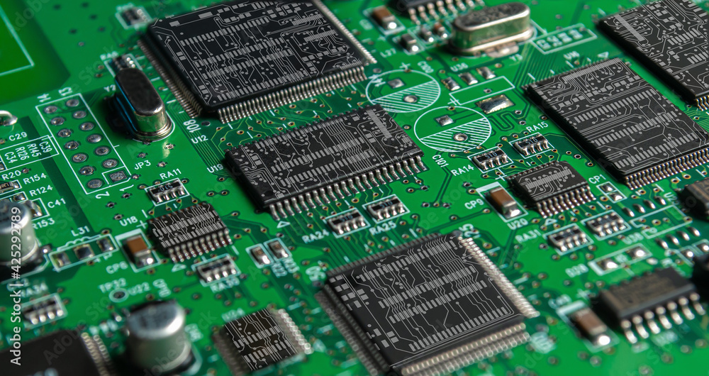 printed circuit board with surface mounted passive and active circuit components close up printed circuit board with surface mounted passive and active circuit components close up