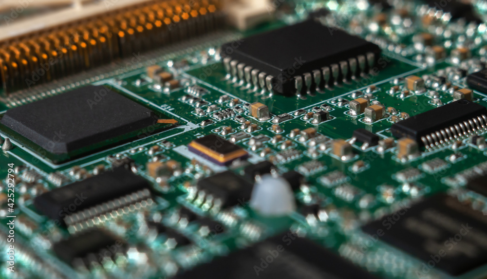 printed circuit board with surface mounted passive and active circuit components close up printed circuit board with surface mounted passive and active circuit components close up