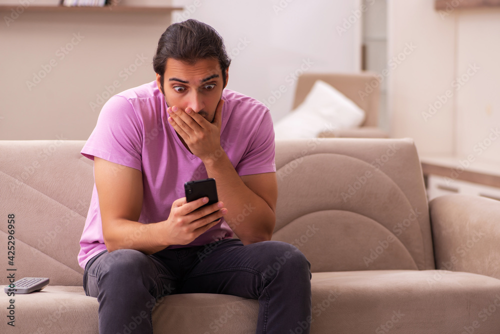 Young man staying at home during pandemic Young man staying at home during pandemic