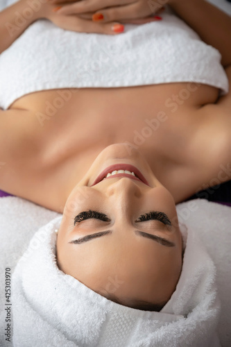 Woman getting a relaxing face spa massage