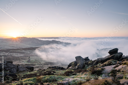 Springtime sunrise cloud inversion, and mist at The Roaches, Staffordshire photo