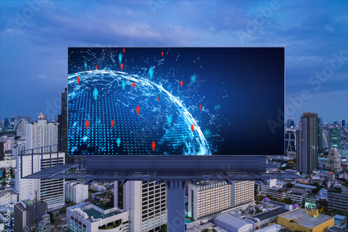 World planet Earth map hologram and social media icons on billboard over night panoramic city view of Bangkok, Southeast Asia. Networking and establishing new connections between people. Globe