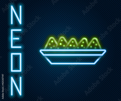 Glowing neon line Nachos in plate icon isolated on black background. Tortilla chips or nachos tortillas. Traditional mexican fast food menu. Colorful outline concept. Vector Illustration