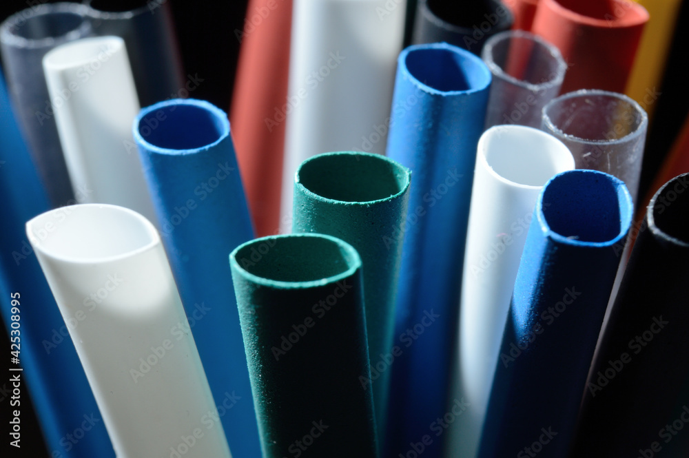 Heat Shrink Tubing to protect cables, dark background. close-up. Heat Shrink Tubing to protect cables, dark background. close-up.