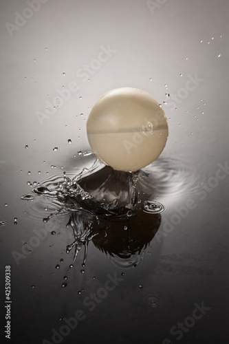 Splash in water surface after falled ball