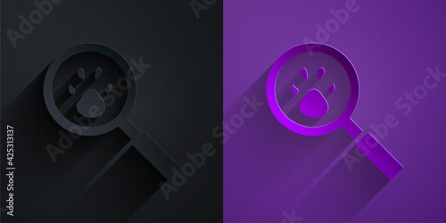 Paper cut Paw search icon isolated on black on purple background. Magnifying glass with animal footprints. Paper art style. Vector