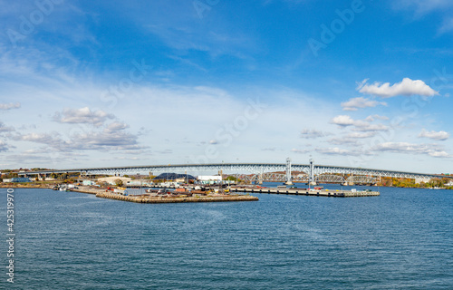 view to skyline of New London with railroad bridge photo