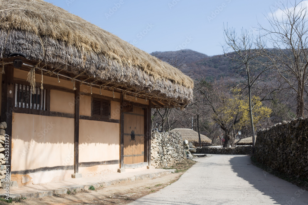 Traditional South Korean thatched roofed house. Roof made of straw. Traditional South Korean thatched roofed house. Roof made of straw.