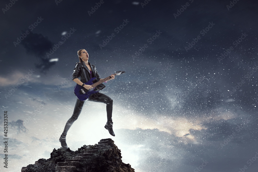 Young and beautiful rock girl playing the electric guitar Young and beautiful rock girl playing the electric guitar
