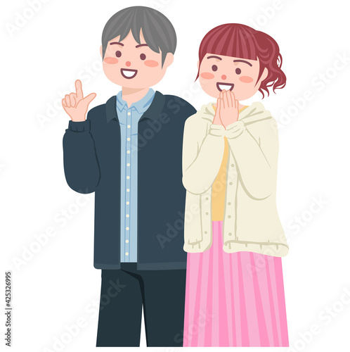 何かを説明している男性と両手を合わせて彼をうっとりと見る女性