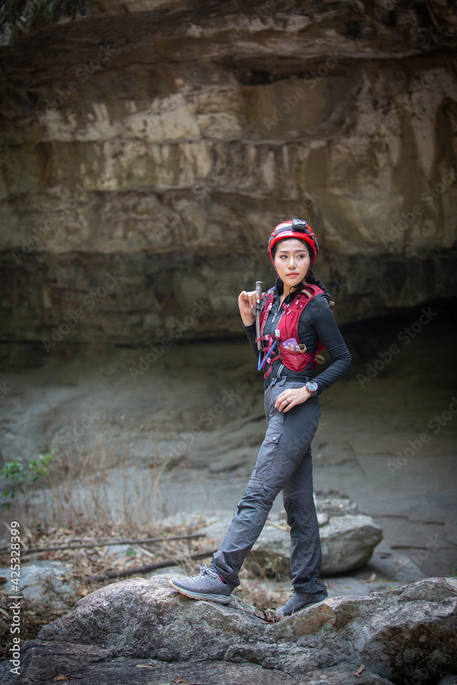 Beautiful young Asian climbers are climbing the high cliffs of northern Thailand.