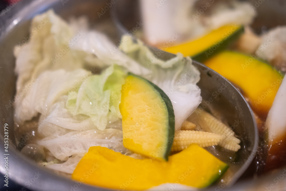 Various fresh vegetable in hot pot for Sukiyaki. Selective focus. Various fresh vegetable in hot pot for Sukiyaki. Selective focus.
