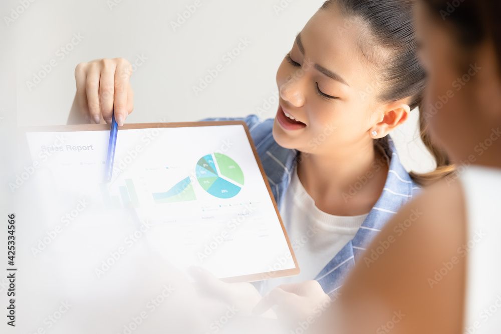 Group of asian partner small business smiling happy and confident. Team working brainstorm project document sheet paperwork together with smile. Business startup company teamwork on meeting in office. Group of asian partner small business smiling happy and confident. Team working brainstorm project document sheet paperwork together with smile. Business startup company teamwork on meeting in office.