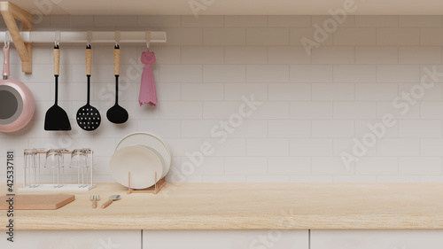 Tableau sur toile Cute cozy clean kitchenware background with pink pan clear glasses white plates wood counter brick wallpaper