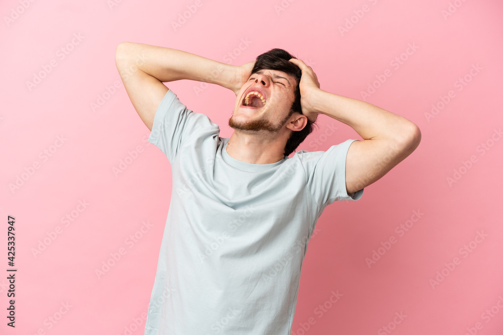 Young Russian man isolated on pink background stressed overwhelmed Young Russian man isolated on pink background stressed overwhelmed