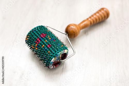 Medical needle roller. Acupuncture massage roller with micro needles to improve blood circulation. Medical applicator, alternative medicine device