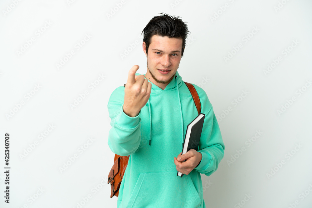 Young student man isolated on white background doing coming gesture Young student man isolated on white background doing coming gesture