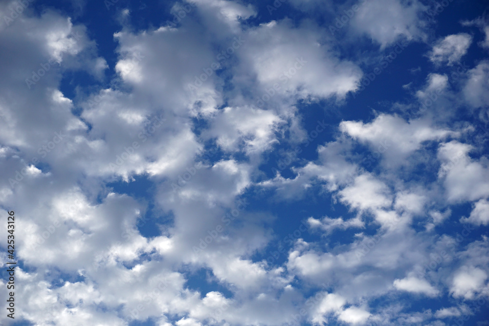 White clouds float in the blue sky. White clouds float in the blue sky.