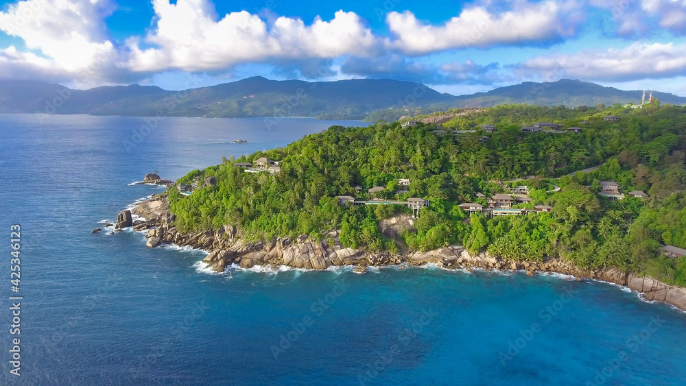 Drone viewpoint of beautiful Anse La Liberte', Seychelles coastline on a sunny day