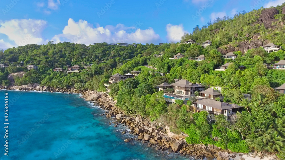 Drone viewpoint of beautiful Anse La Liberte', Seychelles coastline on a sunny day