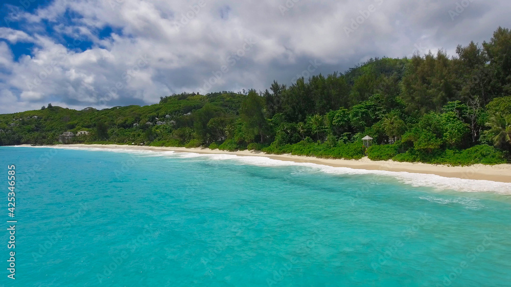 Drone viewpoint of beautiful Seychelles coastline on a sunny day