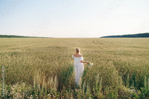 Summer walk in a field with flowers