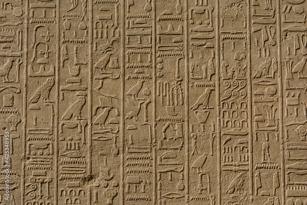 Egyptian ancient hieroglyphs on the stone wall