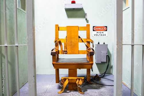 Konstfotografi Wooden electric chair for death sentence in prison cell