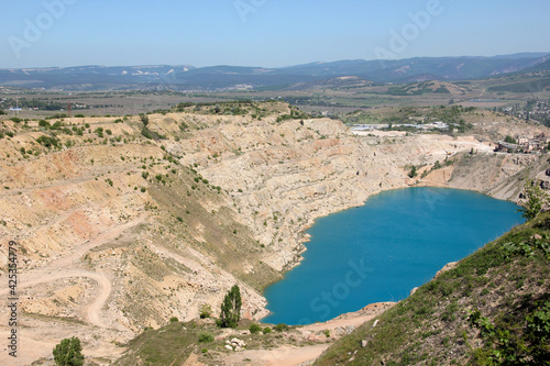 blue quarry lake and rocks