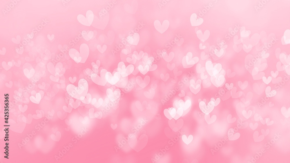 Pink wallpaper background with beautiful heart shape bokeh.