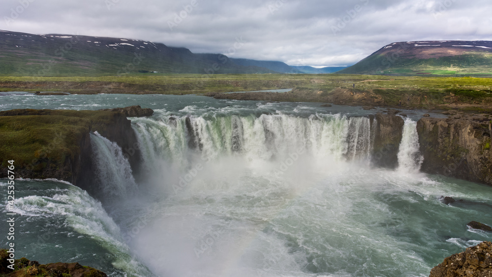 view of the majestic Godafoss waterfall near the city of Akureyri during summer season 