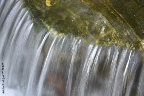 Water flowing over a rock in a stream