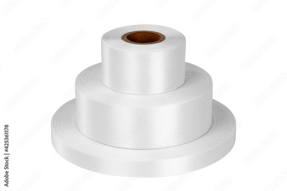 Top view tower of three coils of white satin ribbons of different sizes for labels or branding, isolated without shadows on a white background. Top view tower of three coils of white satin ribbons of different sizes for labels or branding, isolated without shadows on a white background.