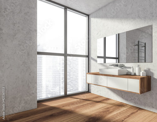 Fototapeta Naklejka Na Ścianę i Meble -  Bathroom interior with sink and mirror on grey wall near window