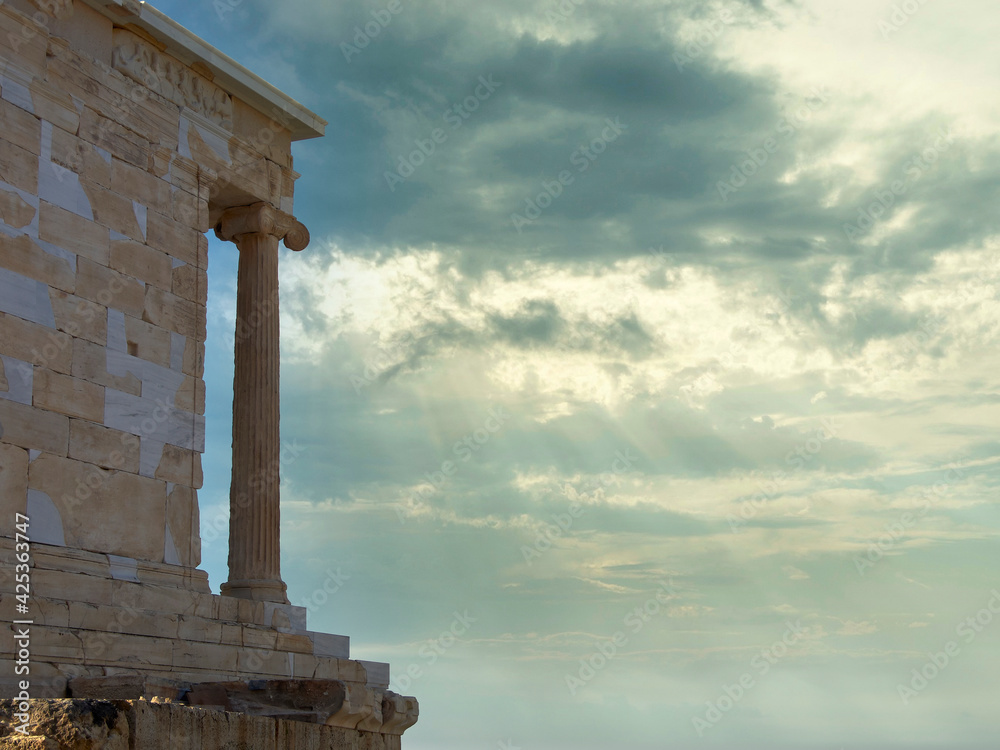 Athens Greece, Athena Nike (Victory) ancient temple on Acropolis hill and impressive sky