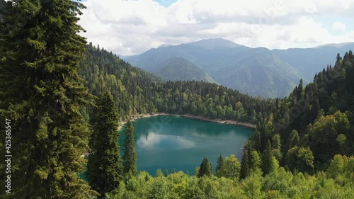 Beautiful small lake in mountain forest, aerial view photo