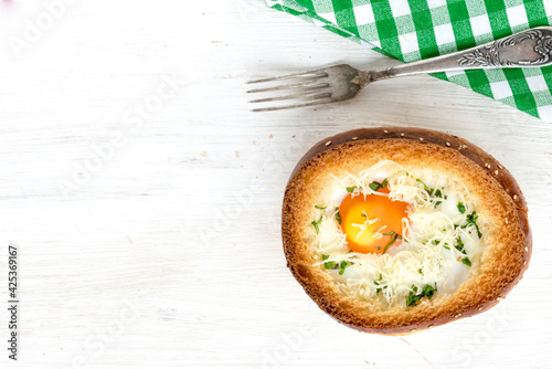 Baked egg in a bun. Healthy protein breakfast. View from above