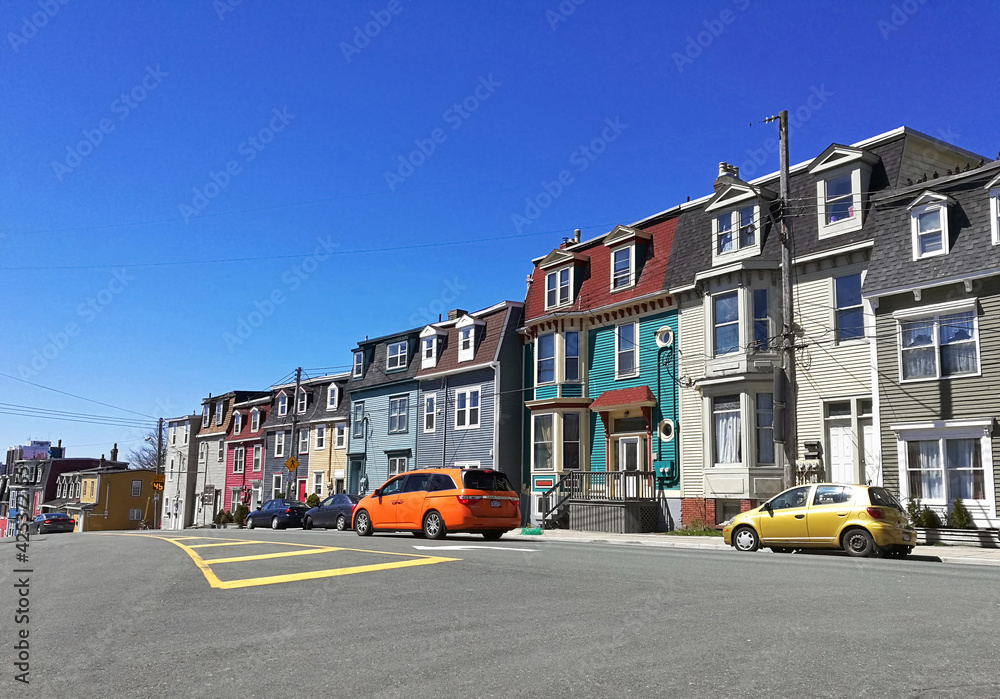 Colorful row houses and colorful cars in St. John's, Newfoundland.