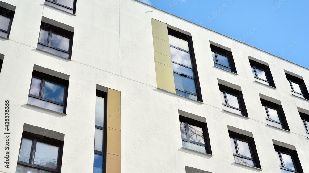 Multistoried modern, new and stylish living block of flats. Newly built apartment building.