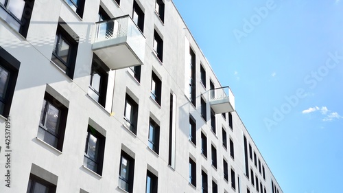 Multistoried modern, new and stylish living block of flats. Newly built apartment building.